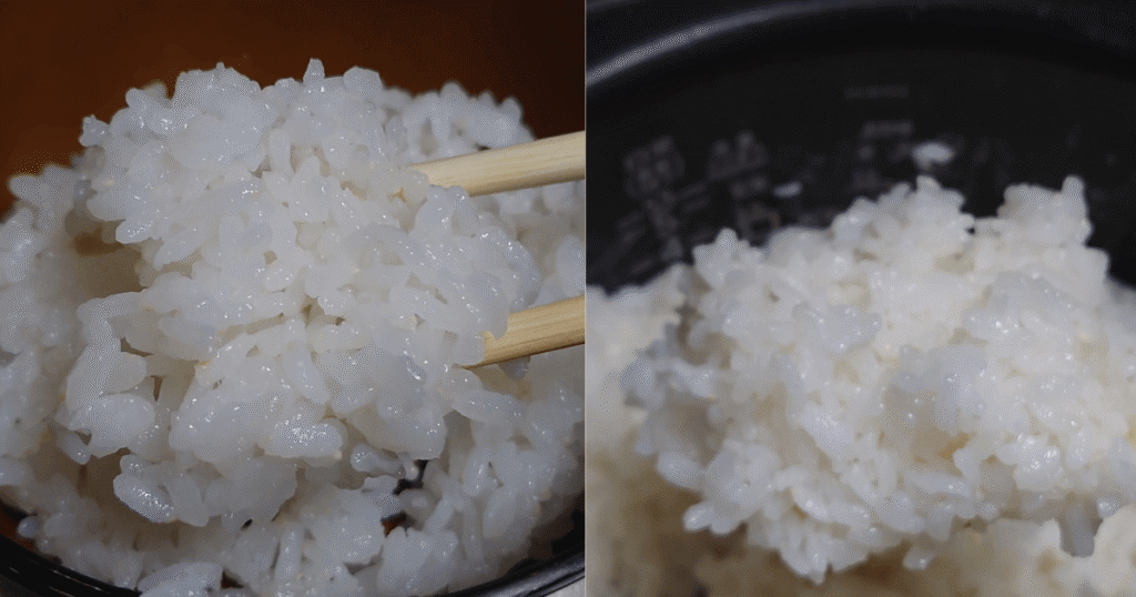 箸で持ち上げた炊きたての新潟県産コシヒカリと炊飯器のご飯