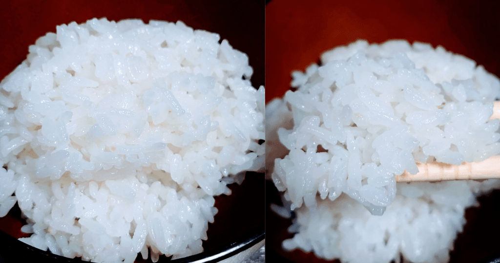 茶碗に盛ったにじのきらめきのご飯と箸で持ち上げた米粒